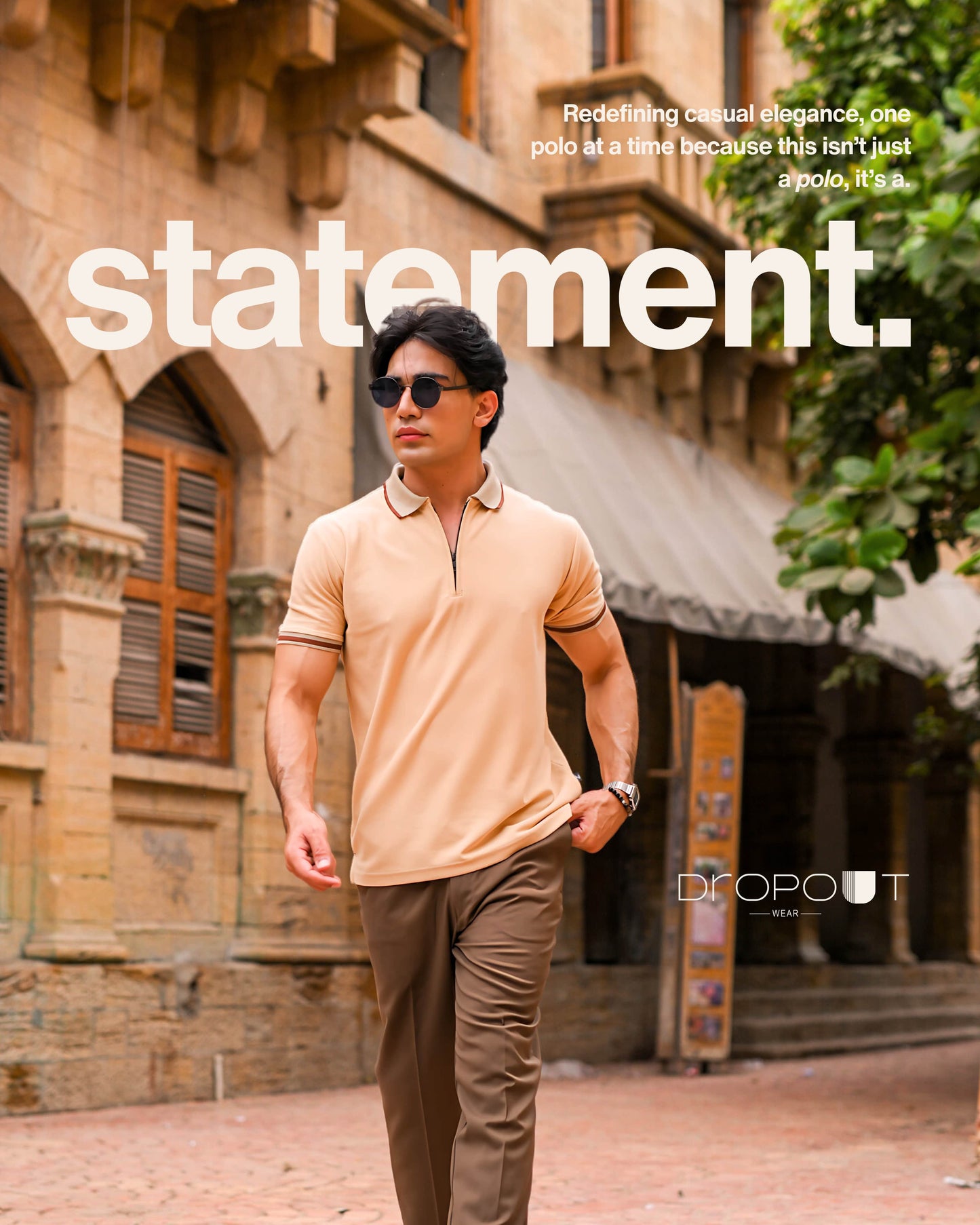 Man wearing a beige polo shirt and sunglasses walking in front of an old building with 'statement.' text overlay.