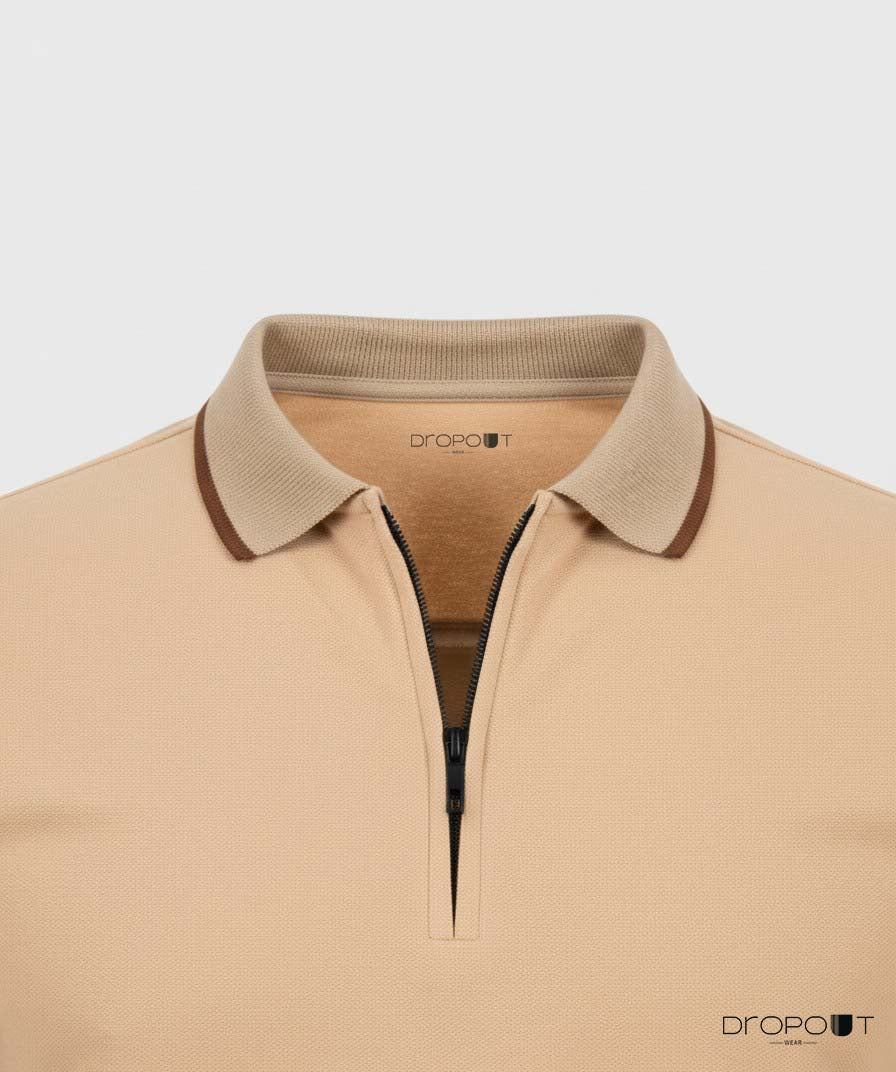 Beige zipper polo with brown collar on a light gray background