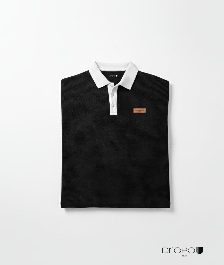 "Men’s black oversized polo in waffle knit fabric with short sleeves and soft feel"