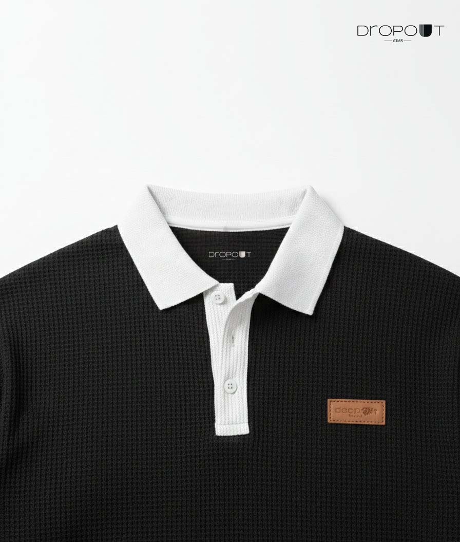 "Casual oversized waffle knit polo in black, featuring breathable textured design"