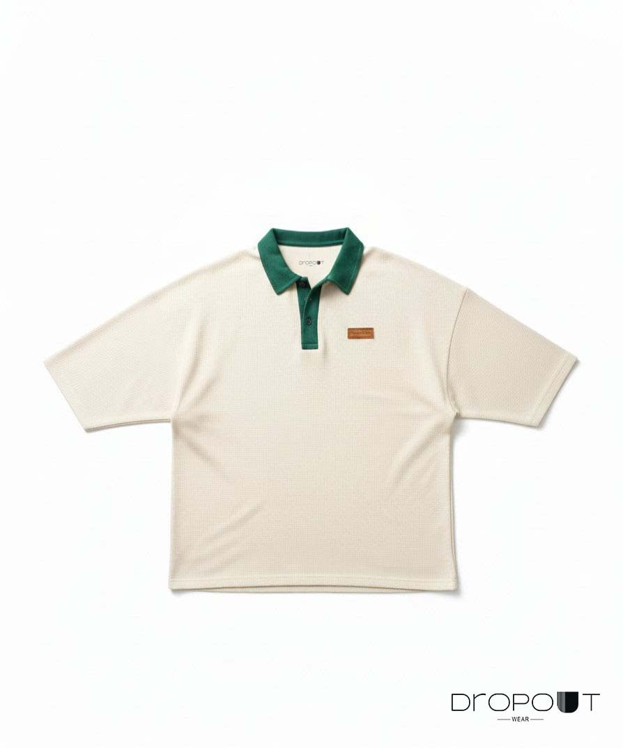 "Oversized off-white waffle knit polo shirt with textured fabric and relaxed fit"