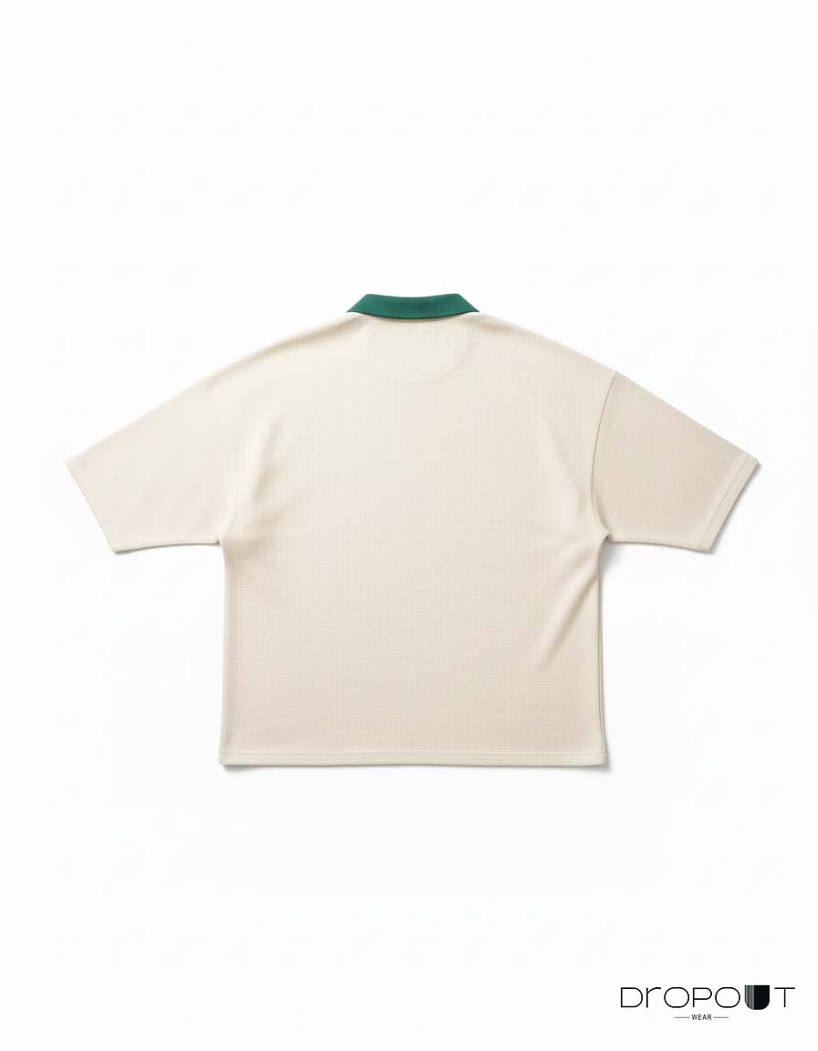 "Unisex oversized polo in off-white waffle knit, featuring classic collar and drop shoulders"