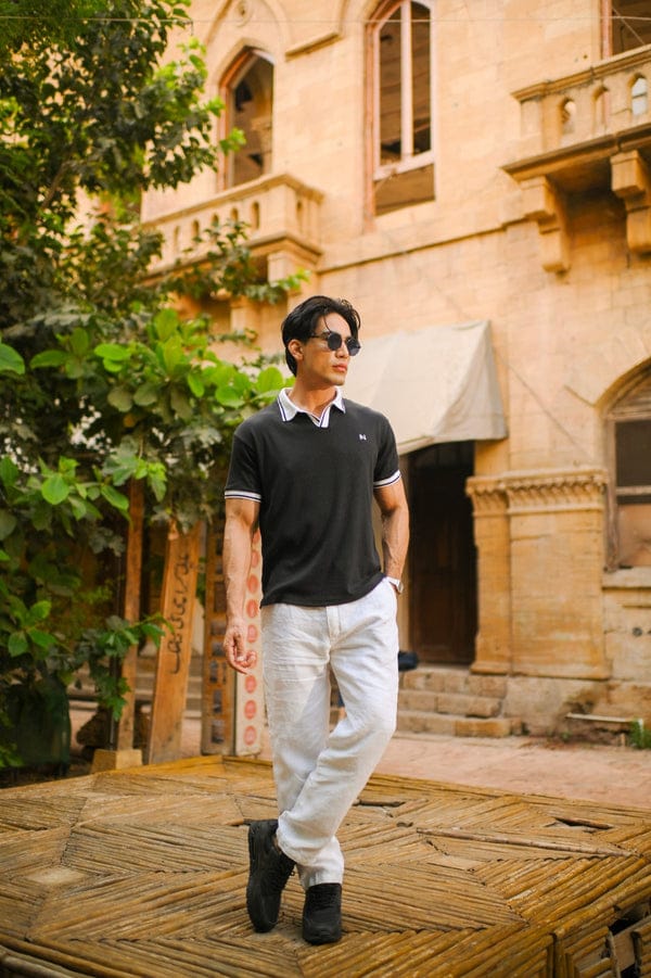 "Minimalist black V-neck polo for men – lightweight textured fabric"