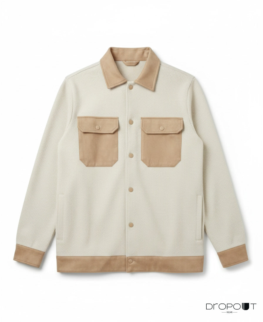 “Camel knitted suede shacket with suede collar, cuffs, hem, and front pockets, finished with two handmade brass buttons covered in suede.”