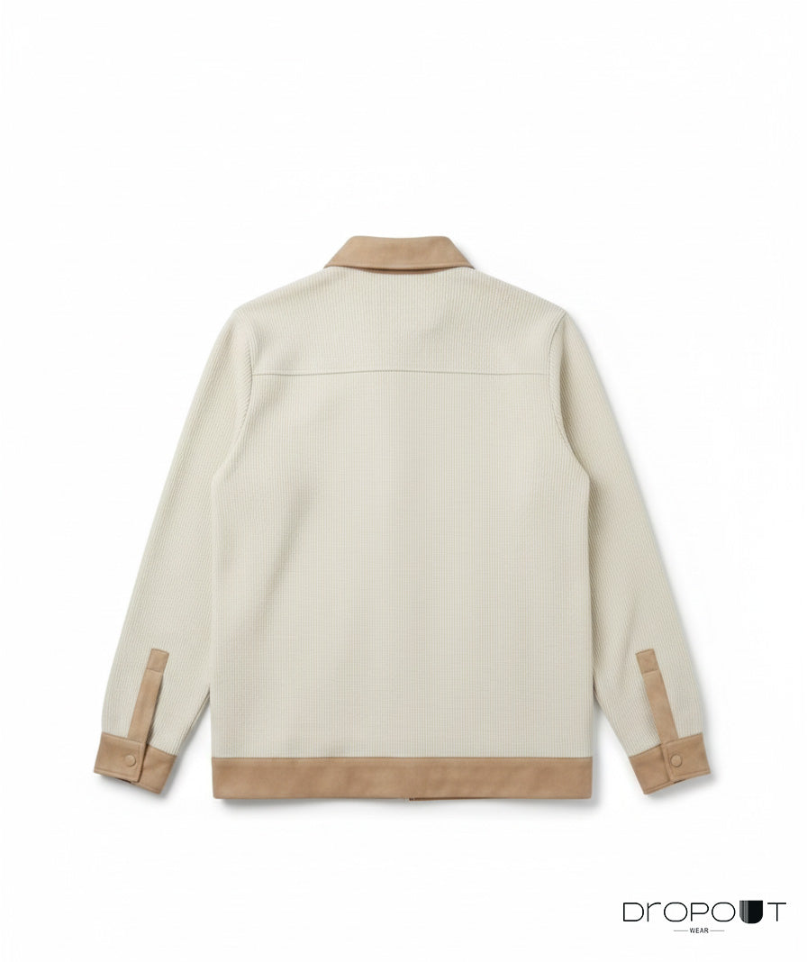 Stylish camel knitted shacket with suede accents on the collar, cuffs, hem, and pockets, completed with two unique handmade brass buttons wrapped in suede.”
