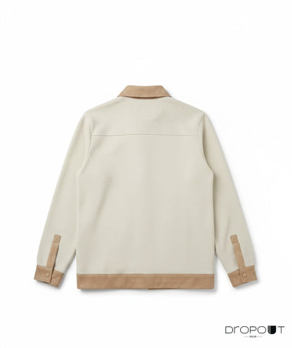 Stylish camel knitted shacket with suede accents on the collar, cuffs, hem, and pockets, completed with two unique handmade brass buttons wrapped in suede.”
