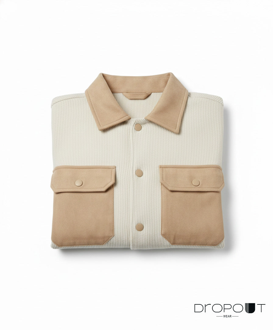 “Camel-colored knitted suede shacket showcasing suede trim throughout and two handcrafted brass buttons with suede on the surface.”